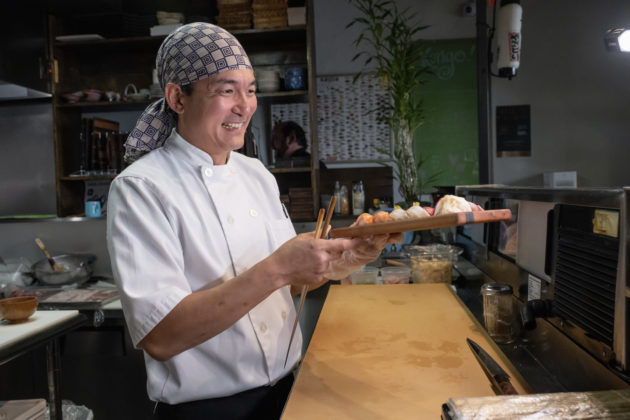 Kengo serves sushi