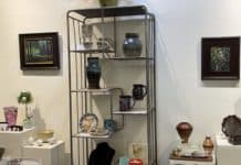 interior shot of Angelwood Gallery, showing art on display and for sale