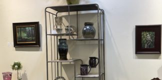 interior shot of Angelwood Gallery, showing art on display and for sale