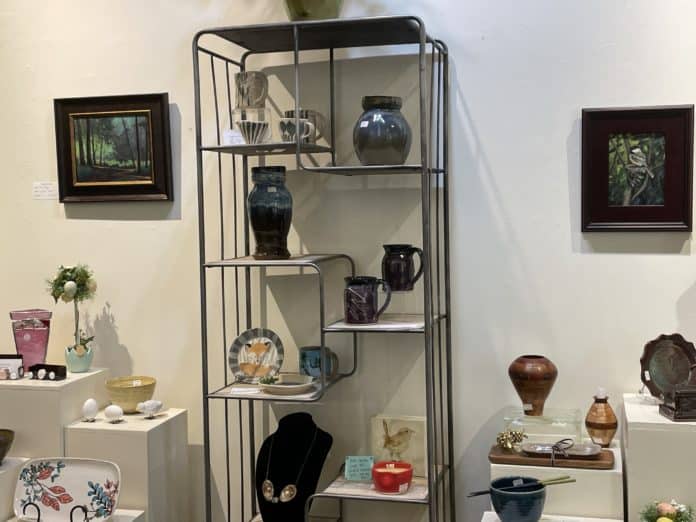 interior shot of Angelwood Gallery, showing art on display and for sale