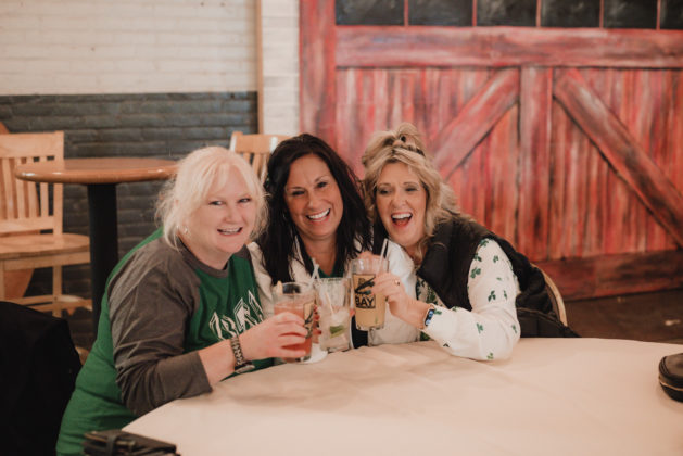 Three women cheers