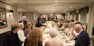 Toledo club members sit