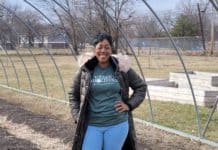 Sonia Flunder-McNair, nonprofit director, stands in front of a future greenhouse