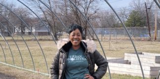 Sonia Flunder-McNair, nonprofit director, stands in front of a future greenhouse