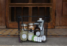 wire basket containing personal care products in reusable containers