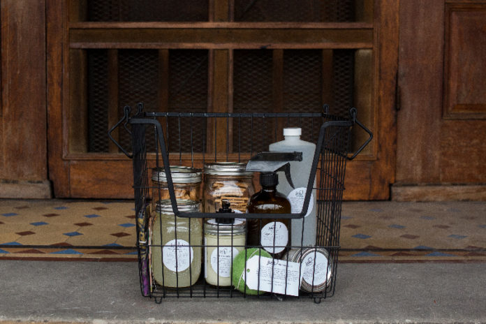 wire basket containing personal care products in reusable containers
