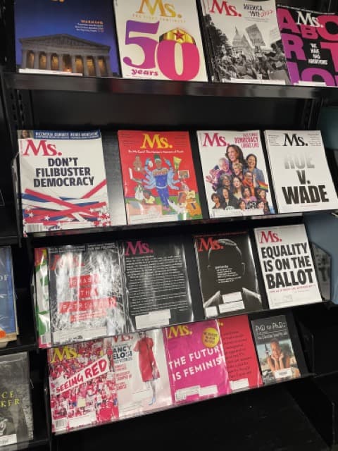 ms-mag-racks twenty copies of Ms. magazine are displayed on magazine racks at Main Library