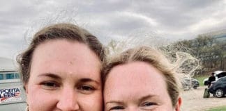 the team's president and vice president stand on the rugby field