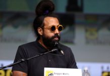 portrait of musician reggie watts wearing sunglasses