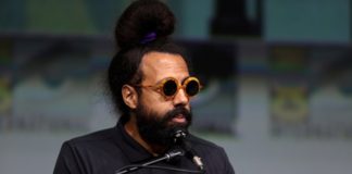 portrait of musician reggie watts wearing sunglasses