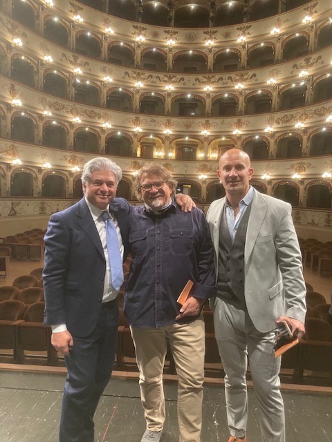 Three organizers of the Italian Bowl XLII gather on a stage in Ferrara, Italy after a planning meeting
