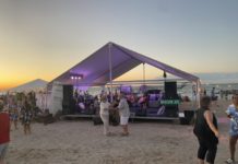 People dance on the beach