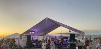 People dance on the beach