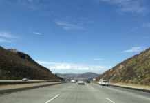 A car drives down the road
