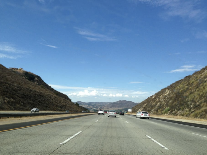 A car drives down the road