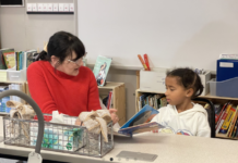 A woman teaches a child