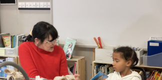 A woman teaches a child