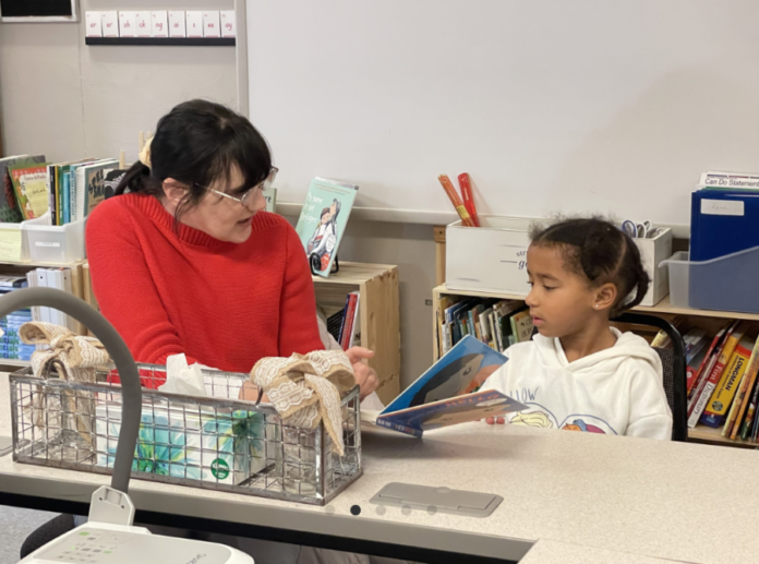 A woman teaches a child