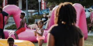 A little girl plays with inflatables