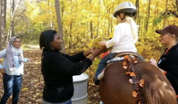 A little kid on horseback