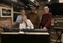 Bob Manley, Clark Brooks, John Johnson (left to right, standing), and Tim Tiderman (sitting) of Organic Ingredients