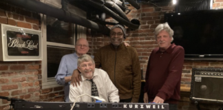 Bob Manley, Clark Brooks, John Johnson (left to right, standing), and Tim Tiderman (sitting) of Organic Ingredients
