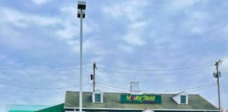 Outside of the new plant store's front with their sign.