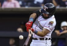 Toledo Mudhen batter breaking his bat hitting a ball