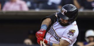 Toledo Mudhen batter breaking his bat hitting a ball