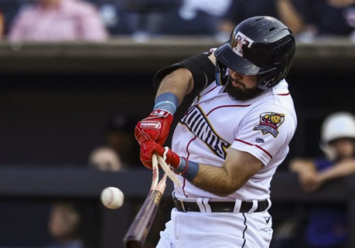 Toledo Mudhen batter breaking his bat hitting a ball