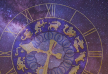 A galaxy colored background with a faded astrology clock with all the month's zodiac symbols.