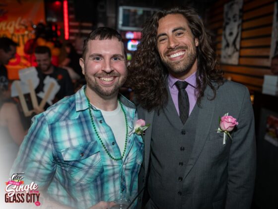 Two men smiling for a photo.