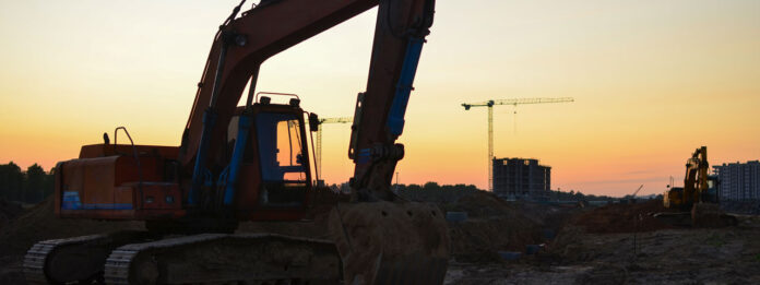 A bulldozer next to debris.