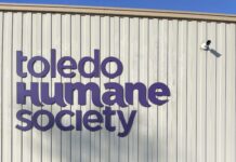 The Toledo Humane Society purple colored sign on their facility building located in Maumee.