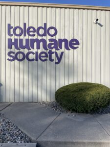 The Toledo Humane Society purple colored sign on their facility building located in Maumee.