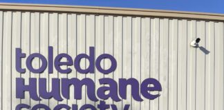 The Toledo Humane Society purple colored sign on their facility building located in Maumee.