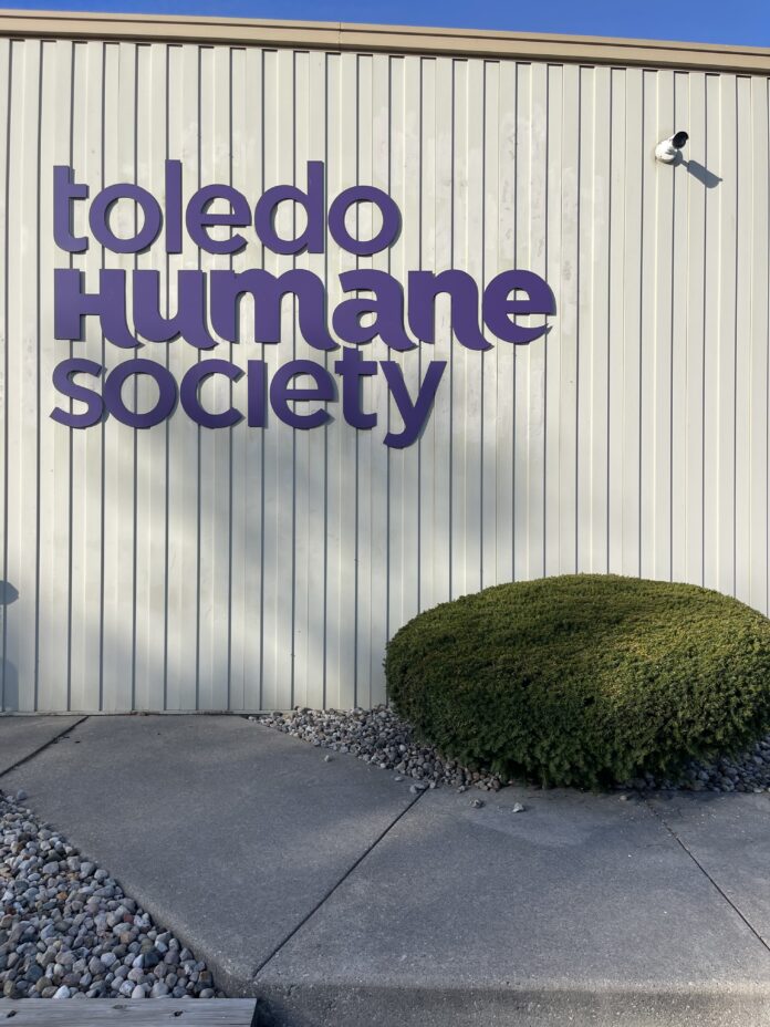 The Toledo Humane Society purple colored sign on their facility building located in Maumee.