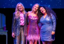 The stars of Mama, I'm a Big Girl Now stand together on stage.